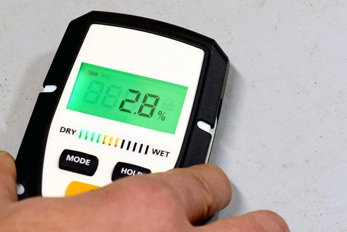moisture testing tool on concrete floor